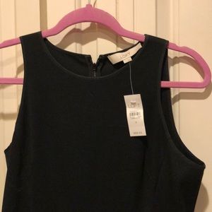 Black peplum sleeveless work dress